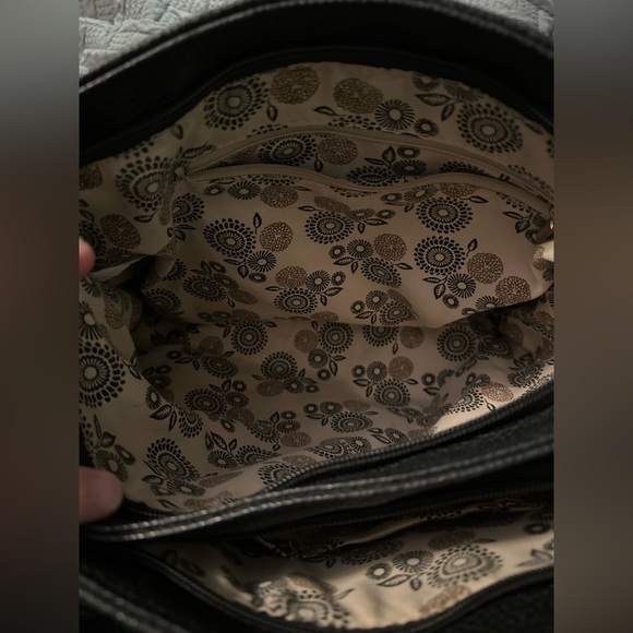 Elegant Black Leather Handbag with Gold Medallion